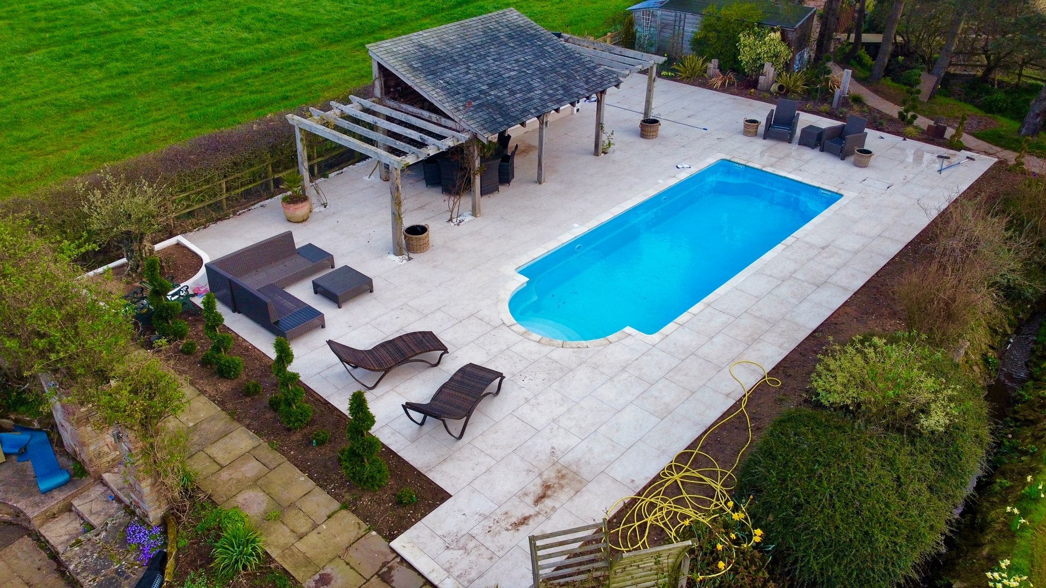 Fibreglass swimming pool with Roman entry steps