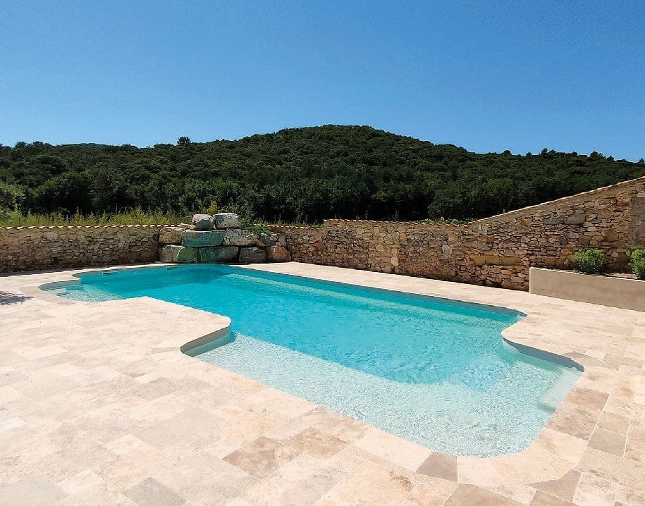Neuvea Relax fibreglass swimming pool with integrated lounge area