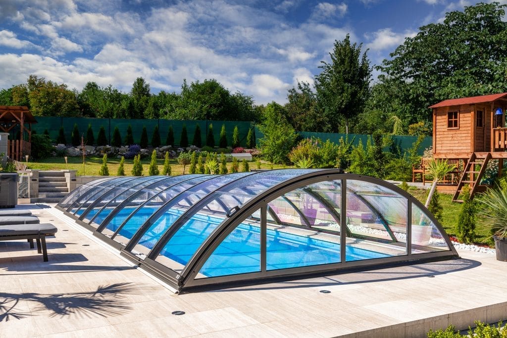 Six metre skimmer swimming pool with Klasik A telescopic enclosure