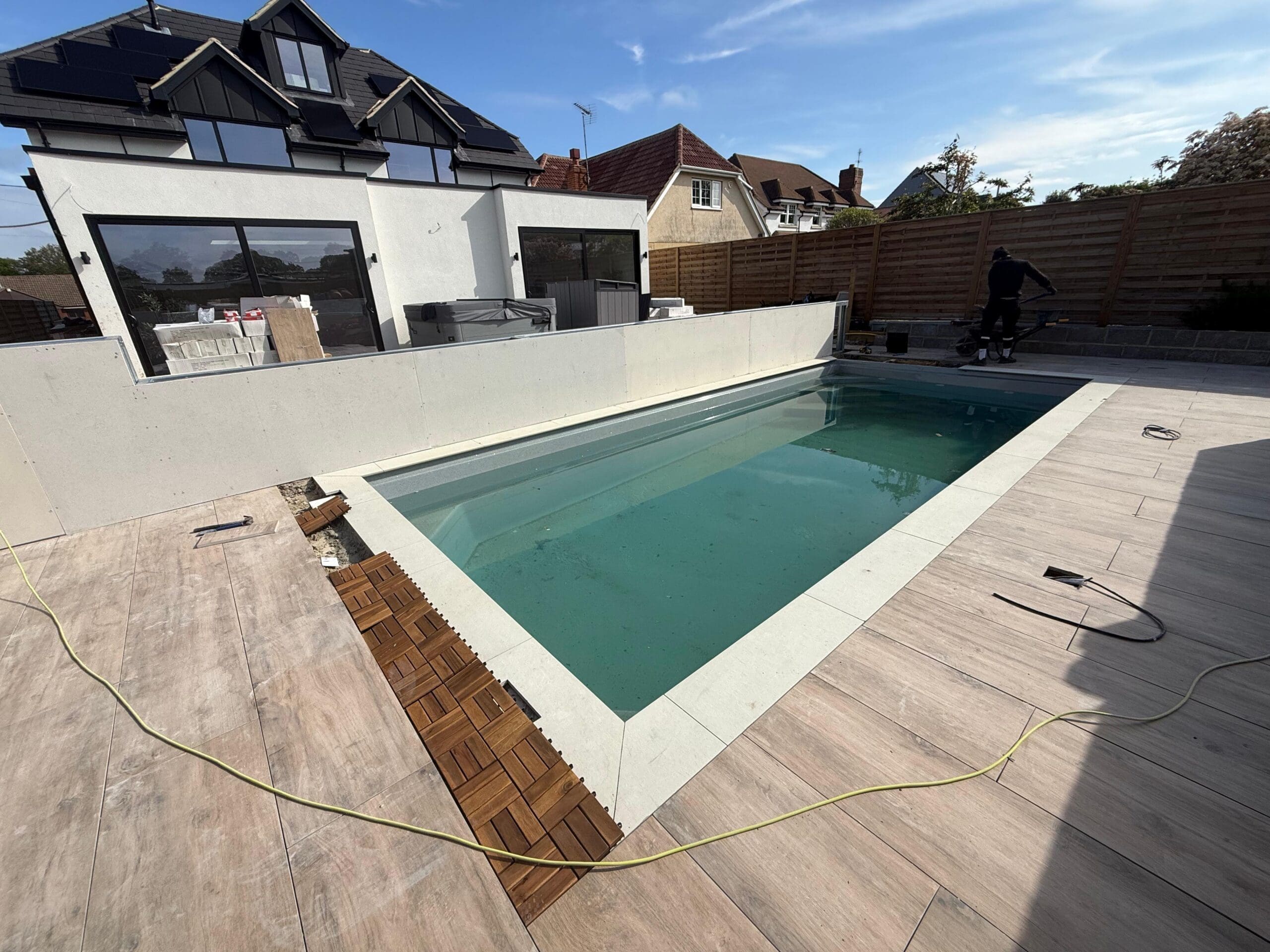 Sycillia pool shell positioned within the prepared garden