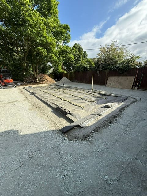 Sloping bottom pool excavation